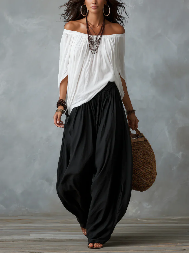 Conjunto de top blanco con hombros descubiertos y pantalón acampanado