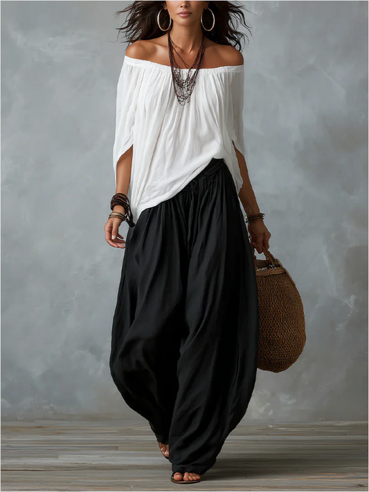 Conjunto de top blanco con hombros descubiertos y pantalón acampanado
