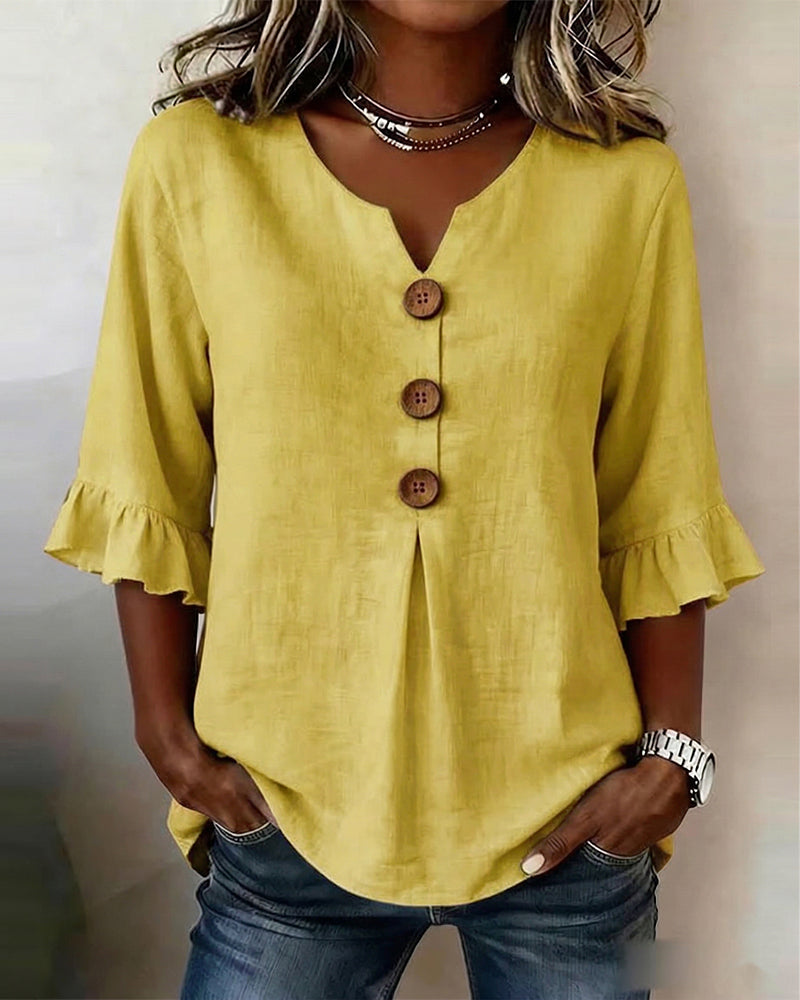 Blusa Sofía de algodón-lino lisa con botones de madera y volantes